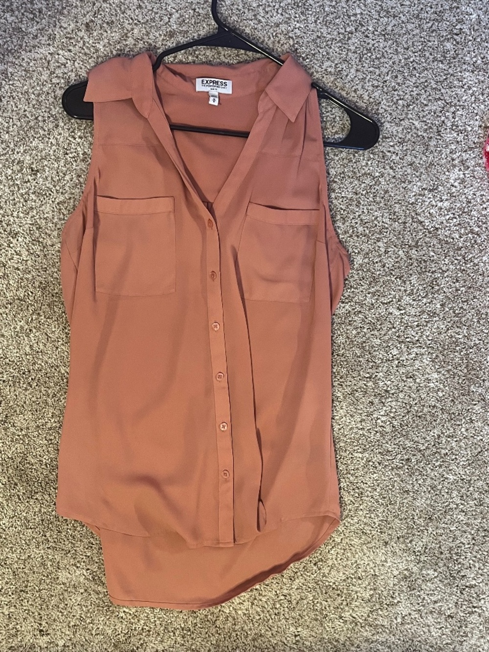 Pink sleeveless button up